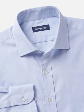 Camisa azul claro lisa de punto fácil de planchar
