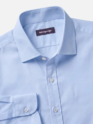 Camisa azul cielo lisa de planchado fácil de punta a punta
